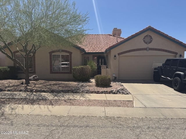 500 S Chalet Ave, Tucson, AZ 85748 - view of front of house featuring a tiled roof, stucco siding, a chimney, a garage, and concrete driveway