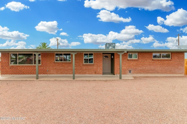 7433 E 19th St, Tucson, AZ 85710 - ranch-style home featuring brick siding