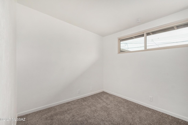 7433 E 19th St, Tucson, AZ 85710 - spare room featuring carpet flooring, baseboards, and a smoke detector