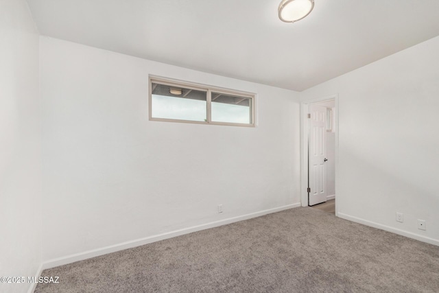 7433 E 19th St, Tucson, AZ 85710 - spare room featuring baseboards and carpet