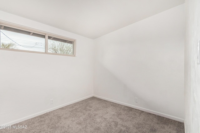 7433 E 19th St, Tucson, AZ 85710 - spare room featuring carpet flooring and baseboards