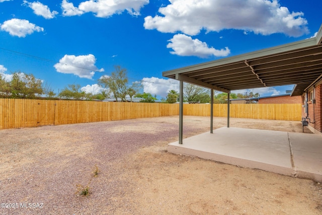 7433 E 19th St, Tucson, AZ 85710 - fenced backyard featuring a patio