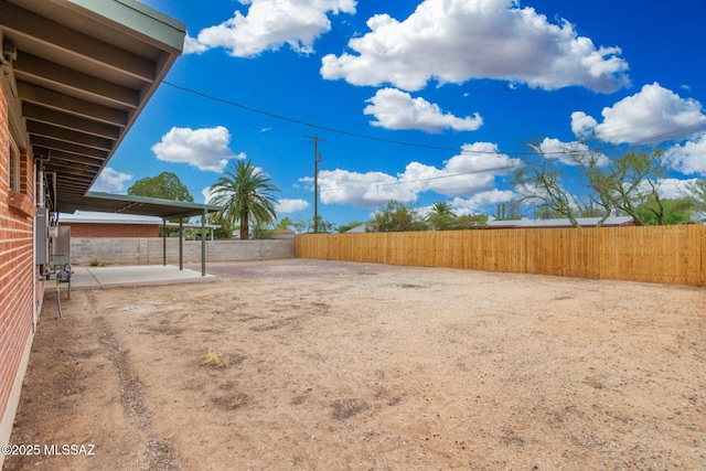 7433 E 19th St, Tucson, AZ 85710 - fenced backyard with a patio area