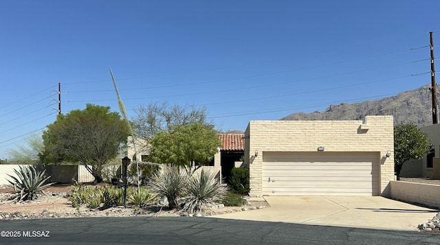 4241 E Aquarius Dr, Tucson, AZ 85718 - view of front facade featuring an attached garage and driveway