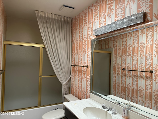 4241 E Aquarius Dr, Tucson, AZ 85718 - bathroom featuring toilet, vanity, wallpapered walls, and enclosed tub / shower combo