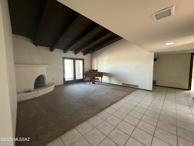 4241 E Aquarius Dr, Tucson, AZ 85718 - living room with light tile patterned floors, light carpet, french doors, and a fireplace with raised hearth