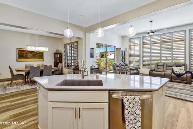 61672 E Talc St, Oracle, AZ 85623 - kitchen featuring open floor plan, light wood-style flooring, a sink, and ceiling fan