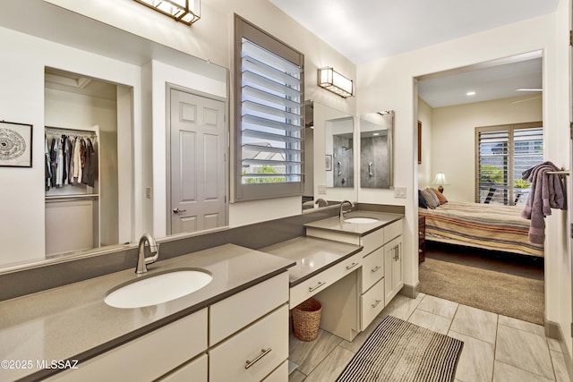 61672 E Talc St, Oracle, AZ 85623 - bathroom with double vanity, plenty of natural light, ensuite bathroom, and a walk in closet
