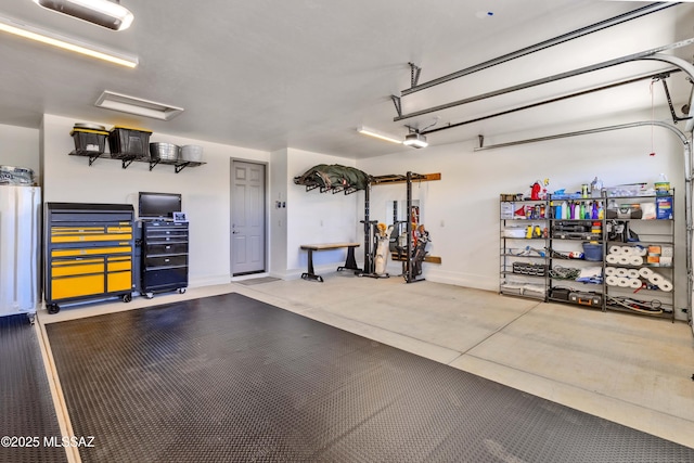 61672 E Talc St, Oracle, AZ 85623 - garage featuring a garage door opener and baseboards