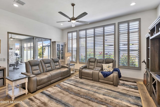 61672 E Talc St, Oracle, AZ 85623 - living room featuring ceiling fan, wood finished floors, recessed lighting, and baseboards