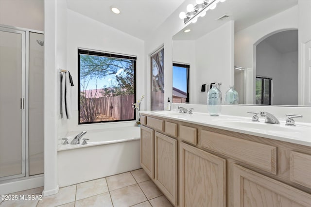 2311 N Creek Vista Dr, Tucson, AZ 85749 - bathroom with a stall shower, double vanity, a bath, tile patterned flooring, and recessed lighting