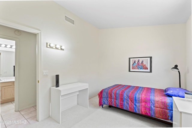 2311 N Creek Vista Dr, Tucson, AZ 85749 - bedroom with ensuite bathroom, light tile patterned flooring, and baseboards