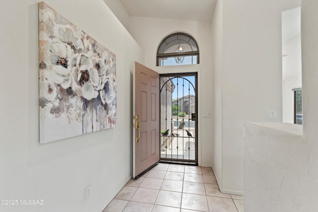 2311 N Creek Vista Dr, Tucson, AZ 85749 - foyer featuring plenty of natural light, light tile patterned floors, baseboards, and a towering ceiling