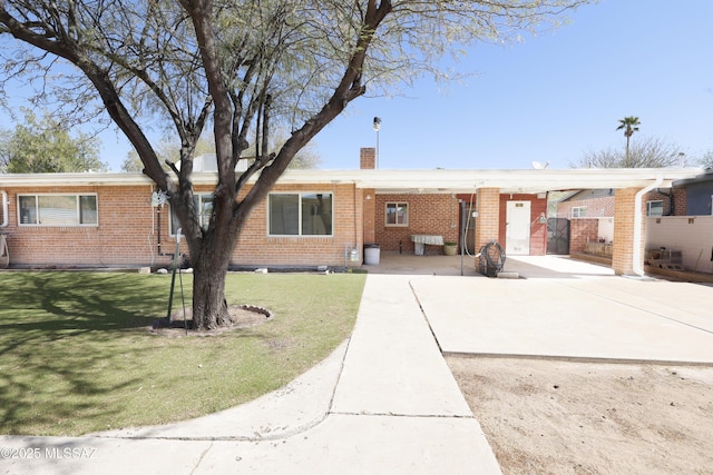 3010 E Sylvia St, Tucson, AZ 85716 - single story home with brick siding and a chimney