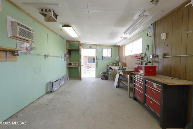 3010 E Sylvia St, Tucson, AZ 85716 - below grade area featuring a workshop area and a wall unit AC