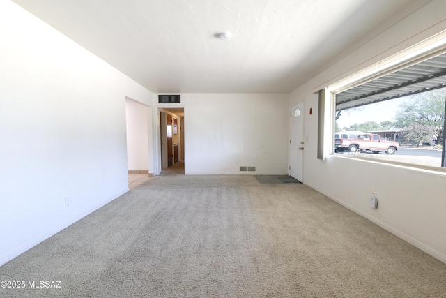 3010 E Sylvia St, Tucson, AZ 85716 - carpeted spare room featuring baseboards and a smoke detector