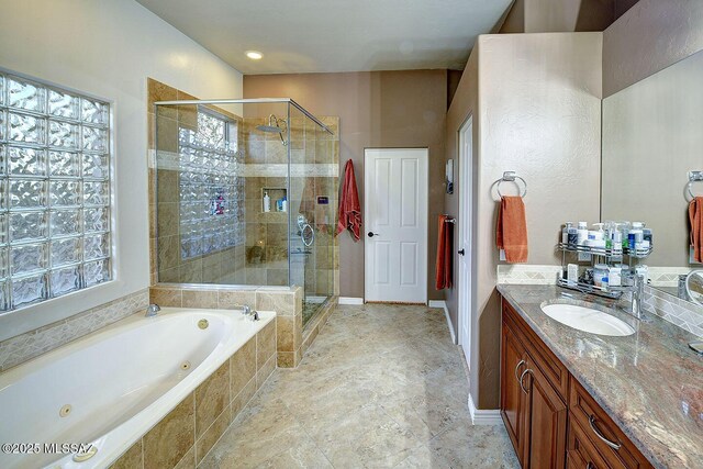 2500 N Fennimore Ave, Tucson, AZ 85749 - bathroom featuring a whirlpool tub, vanity, and a shower stall