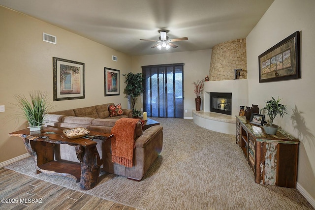 2500 N Fennimore Ave, Tucson, AZ 85749 - living area featuring ceiling fan, baseboards, a large fireplace, and wood finished floors