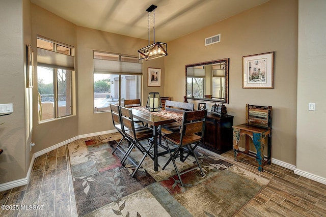 2500 N Fennimore Ave, Tucson, AZ 85749 - dining area featuring wood finished floors, baseboards, and a chandelier