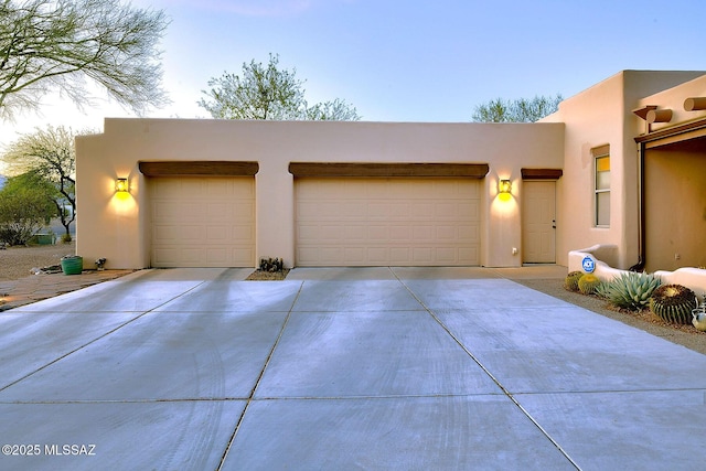 2500 N Fennimore Ave, Tucson, AZ 85749 - view of front of property with concrete driveway, stucco siding, and a garage
