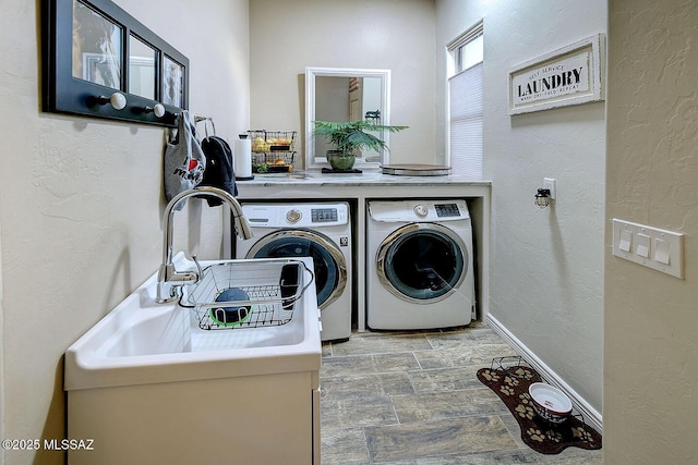 2500 N Fennimore Ave, Tucson, AZ 85749 - laundry room featuring washing machine and clothes dryer and a textured wall