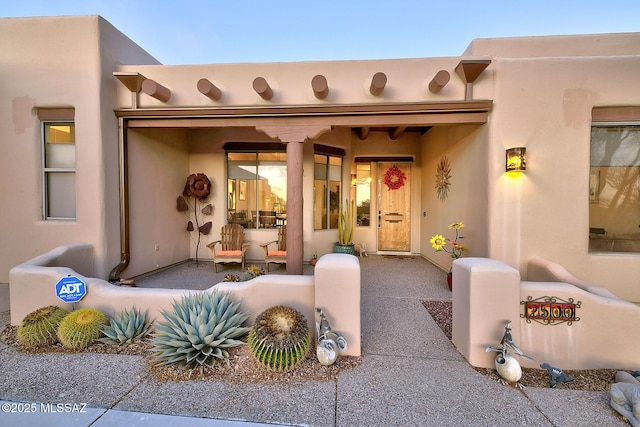 2500 N Fennimore Ave, Tucson, AZ 85749 - entrance to property with stucco siding and covered porch
