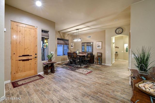 2500 N Fennimore Ave, Tucson, AZ 85749 - foyer entrance with arched walkways, wood finished floors, baseboards, and recessed lighting