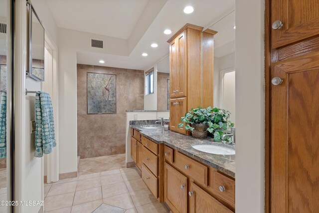 14488 N Rock Springs Ln, Oro Valley, AZ 85755 - full bath with double vanity, tile patterned floors, recessed lighting, and walk in shower