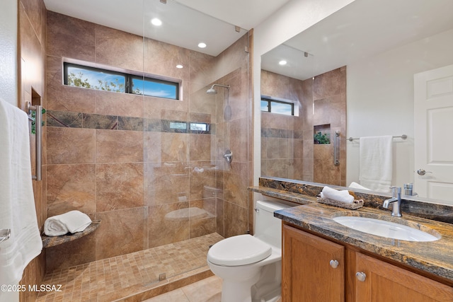 14488 N Rock Springs Ln, Oro Valley, AZ 85755 - full bathroom with vanity, a walk in shower, toilet, and tile patterned flooring