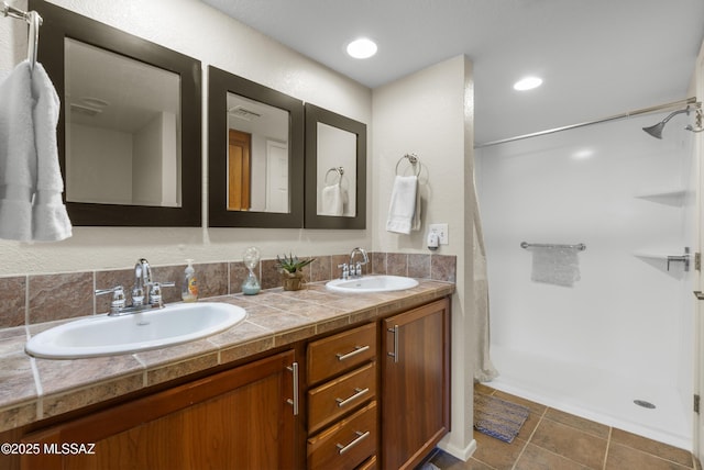 5051 N Sabino Canyon Rd Unit 2162, Tucson, AZ 85750 - full bathroom featuring double vanity, curtained shower, and tile patterned floors