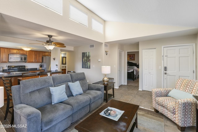 5051 N Sabino Canyon Rd Unit 2162, Tucson, AZ 85750 - tiled living room with high vaulted ceiling, a ceiling fan, and baseboards