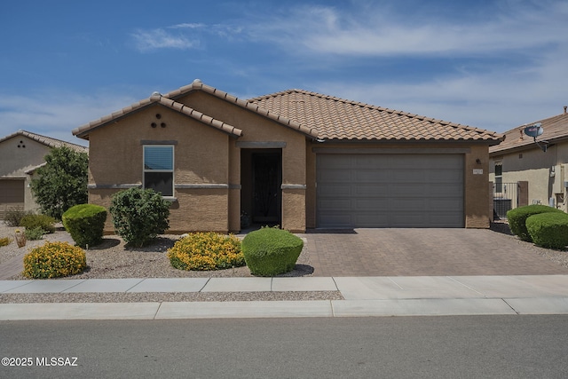14171 E Adeline Dr, Vail, AZ 85641 - view of front facade featuring stucco siding, driveway, an attached garage, and a tile roof