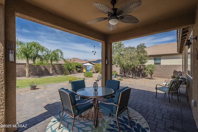14171 E Adeline Dr, Vail, AZ 85641 - fenced backyard featuring a patio area, ceiling fan, and outdoor dining space
