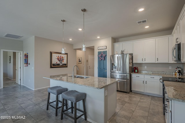 14171 E Adeline Dr, Vail, AZ 85641 - kitchen with appliances with stainless steel finishes, a sink, white cabinetry, recessed lighting, and a center island with sink