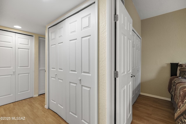 5051 N Sabino Canyon Rd Unit 1107, Tucson, AZ 85750 - unfurnished bedroom featuring baseboards and light wood-type flooring