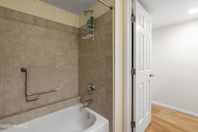 5051 N Sabino Canyon Rd Unit 1107, Tucson, AZ 85750 - full bath with shower / tub combination, baseboards, and wood finished floors