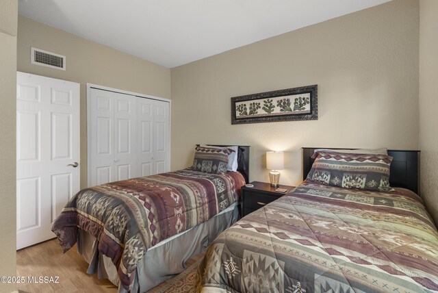 5051 N Sabino Canyon Rd Unit 1107, Tucson, AZ 85750 - bedroom featuring wood finished floors and a closet