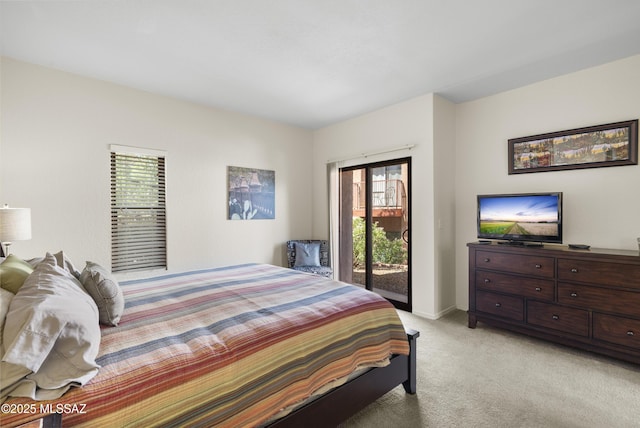 5051 N Sabino Canyon Rd Unit 1107, Tucson, AZ 85750 - bedroom featuring light carpet, access to exterior, and baseboards