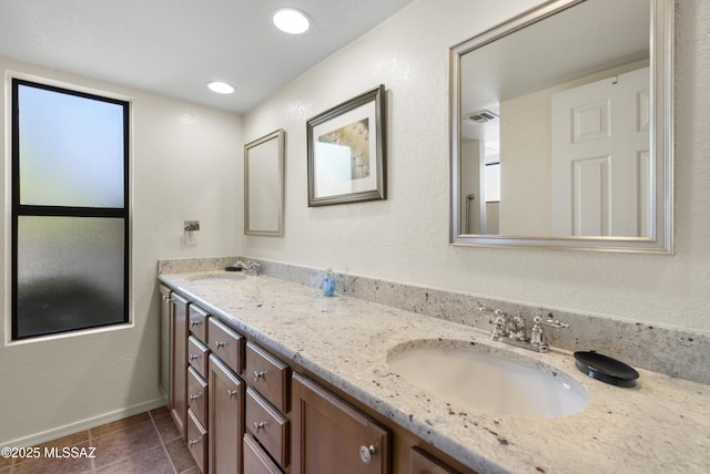 5051 N Sabino Canyon Rd Unit 1107, Tucson, AZ 85750 - full bathroom with double vanity, tile patterned flooring, and baseboards