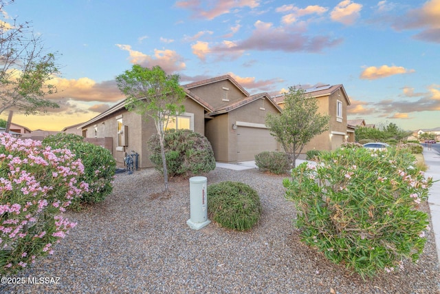 11358 W Folsom Point Dr, Marana, AZ 85658 - view of front of house featuring stucco siding, a garage, and a tile roof