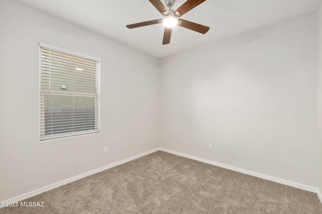 11358 W Folsom Point Dr, Marana, AZ 85658 - spare room featuring carpet flooring, a ceiling fan, and baseboards