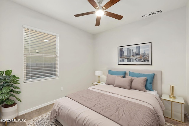 11358 W Folsom Point Dr, Marana, AZ 85658 - bedroom with carpet flooring, baseboards, and ceiling fan