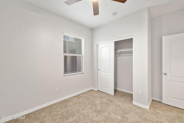 11358 W Folsom Point Dr, Marana, AZ 85658 - unfurnished bedroom with light colored carpet, baseboards, a closet, and ceiling fan
