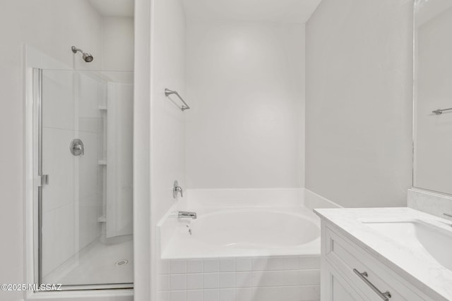 11358 W Folsom Point Dr, Marana, AZ 85658 - bathroom with a shower stall, vanity, and a bath