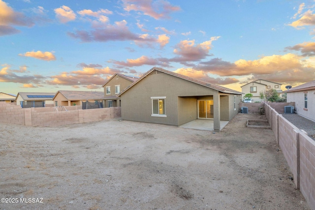 11358 W Folsom Point Dr, Marana, AZ 85658 - back of house featuring a fenced backyard, stucco siding, a patio area, and central AC unit