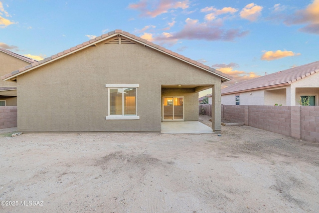 11358 W Folsom Point Dr, Marana, AZ 85658 - rear view of house featuring a fenced backyard, a patio, and stucco siding