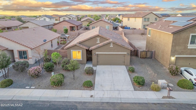 11358 W Folsom Point Dr, Marana, AZ 85658 - traditional-style house with a residential view, a garage, driveway, and stucco siding