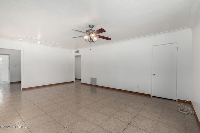 1111 E Lester St, Tucson, AZ 85719 - unfurnished room featuring ceiling fan, track lighting, and baseboards