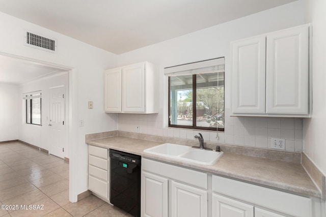 1111 E Lester St, Tucson, AZ 85719 - kitchen featuring dishwasher, a sink, plenty of natural light, and white cabinets