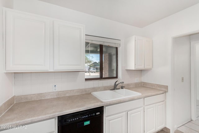 1111 E Lester St, Tucson, AZ 85719 - kitchen with black dishwasher, a sink, white cabinetry, backsplash, and light countertops